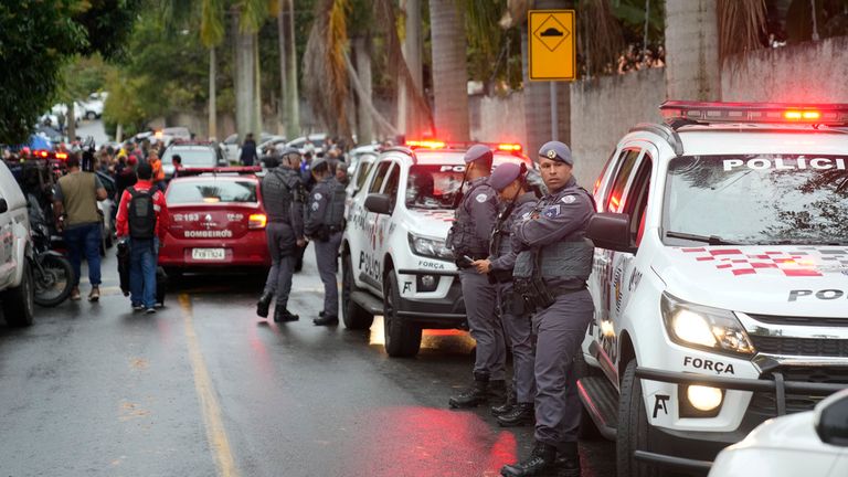 Rescue workers near the accident site. Image: AP