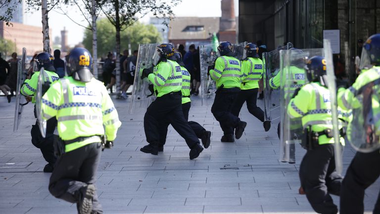 Police charge at protesters in Liverpool, following the stabbing attacks on Monday in Southport, in which three young children were killed. Picture date: Saturday August 3, 2024.

