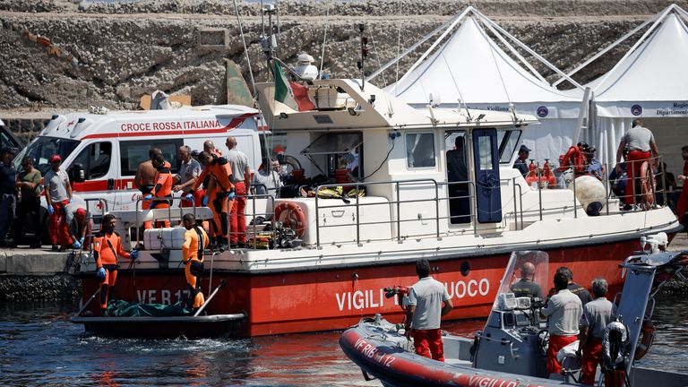 Rescue personnel transport what is believed to be the body of Hannah Lynch, daughter of British tech entrepreneur Mike Lynch, at the scene where a luxury yacht sank, off the coast of Porticello, near the Sicilian city of Palermo, Italy, August 23, 2024. REUTERS/Louiza Vradi