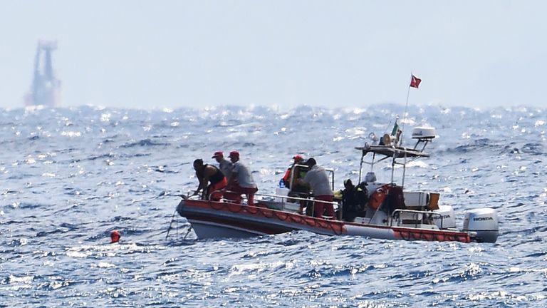 Scuba divers of the Italian Firefighters corp at the scene of the search for a missing boat, in Porticello, southern Italy, Tuesday, Aug. 20, 2024. Rescue teams and divers returned to the site of a storm-sunken superyacht Tuesday to search for six people, including British tech magnate Mike Lynch, who are believed to be still trapped in the hull 50 meters (164-feet) underwater. (AP Photo/Salvatore Cavalli)