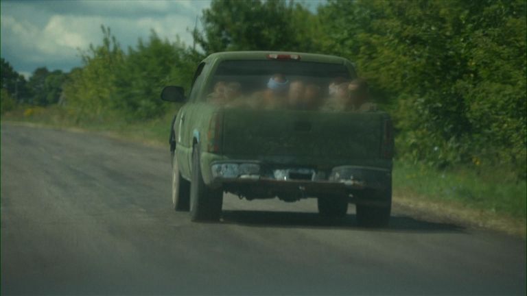 Ukrainian truck carries blindfolded men in Russian uniform
