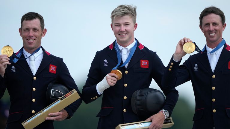 Britain's Scott Brash, right, Harry Charles, center, and Ben Maher show their gold medal after the Equestrian Jumping Team final at the 2024 Summer Olympics, Friday, Aug. 2, 2024, in Versailles, France. Pic: AP 