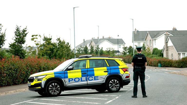 A police officer stands outside the entrance to Rivenwood housing development in Newtownards, Co Down, where more than 400 homes have been evacuated due to an operation to clear what is suspected to be a Second World War-era bomb.  
Pic: PA