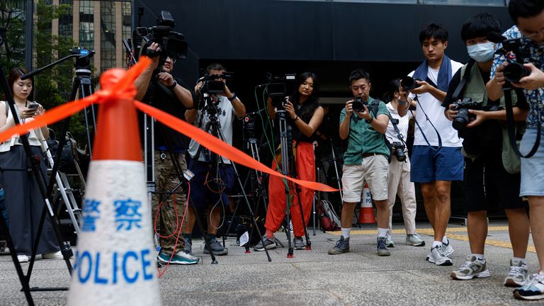 Members of the media work outside District Court ahead of the verdict in a landmark sedition trial.
Pic: Reuters