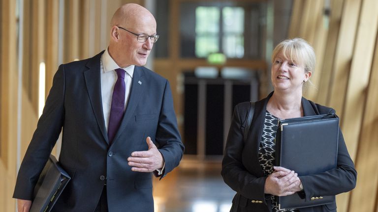 First Minister of Scotland John Swinney and Shona Robison (right) arrive for First Minister's Questions at the Scottish Parliament in Holyrood, Edinburgh. Picture date: Thursday May 16, 2024.