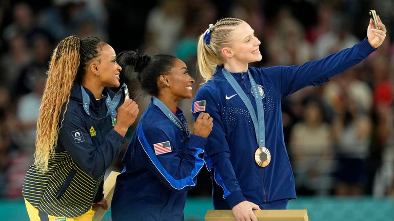 Aug 3, 2024; Paris, France; Rebeca Andrade of Brazil, Simone Biles and Jade Carey of the United States pose for a photo during the medal ceremony for the vault on the first day of gymnastics event finals during the Paris 2024 Olympic Summer Games at Bercy Arena. Pic: Reuters 