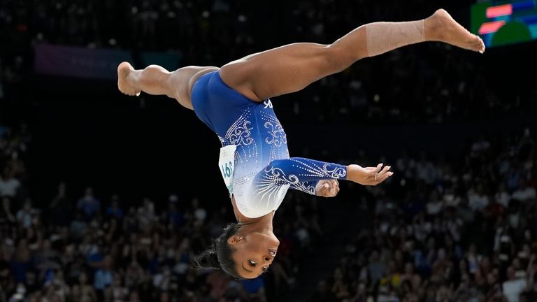 Simone Biles, of the United States, competes during the women's artistic gymnastics individual balance beam finals at Bercy Arena at the 2024 Summer Olympics, Monday, Aug. 5, 2024, in Paris, France. (AP Photo/Abbie Parr)