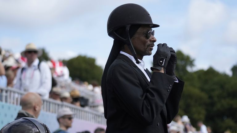 Snoop Dogg during the dressage team Grand Prix final at the 2024 Summer Olympics, Saturday, Aug. 3, 2024, in Versailles, France.  (AP Photo/Mosa'ab Elshamy)