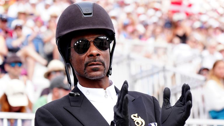 Snoop Dogg watching the Dressage Team Grand Prix Special at the Chateau de Versailles on the eighth day of the 2024 Paris Olympic Games in France. Picture date: Saturday August 3, 2024. Mike Egerton/PA Wire