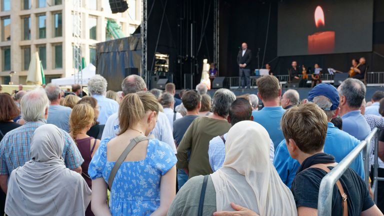 People take part in a prayer service in memory of the victims of the knife attack. Pic: AP