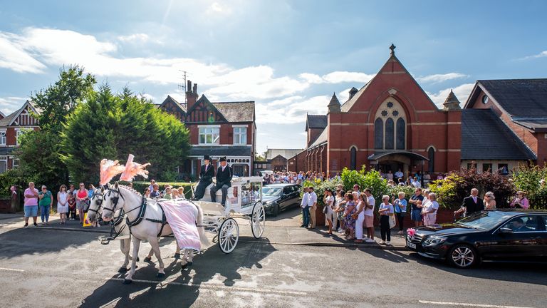 The horse-drawn carriage carrying the coffin of Southport stabbing victim Alice da Silva Aguiar leaves St Patrick's Church, Southport. Pic: PA