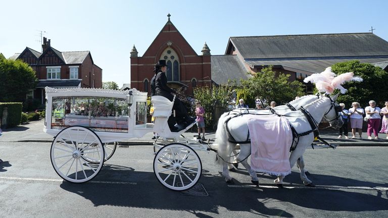 The horse-drawn carriage carrying the coffin of Southport stabbing victim Alice da Silva Aguiar arrives for her funeral at St Patrick's Church, Southport. The nine-year-old died in a knife attack at a dance class in Southport on July 29. Picture date: Sunday August 11, 2024.