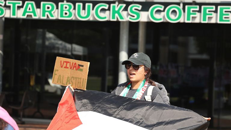 A protester sings during a pro-Palestinian rally at Memory Mall on the University of Central Florida campus in Orlando on Tuesday, May 7, 2024. (Stephen M. Dowell/Orlando Sentinel via AP)