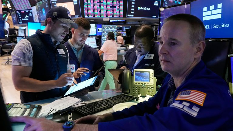 Traders with specialist Stephen Naughton at the New York Stock Exchange. Pic: AP