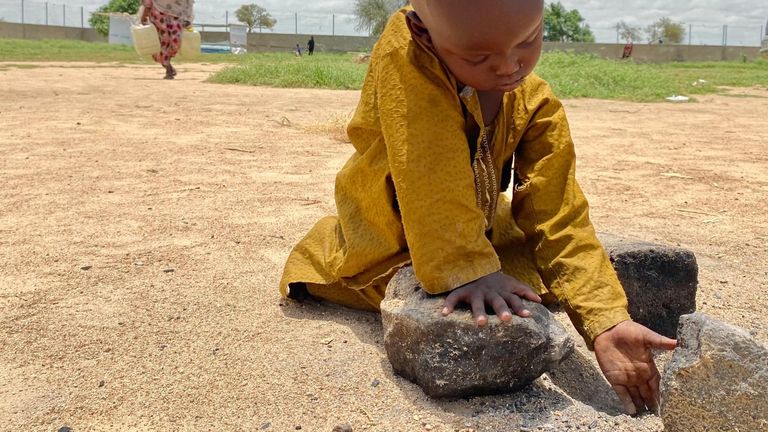 A young boy plays at the refugee transit camp in Tiné - Chad/Sudan border. Pic: Sky News