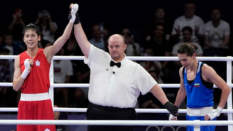 Taiwan's Lin Yu-ting celebrates after defeating Bulgaria's Svetlana Staneva in their women's 57 kg quarterfinal boxing match at the 2024 Summer Olympics, Sunday, Aug. 4, 2024, in Paris, France. (AP Photo/John Locher)