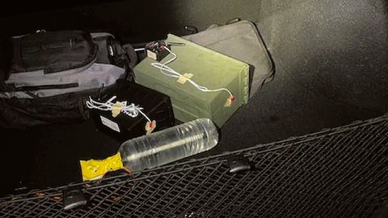 This image provided by the FBI shows two improvised explosive devises as initially discovered in Thomas Matthew Crooks' car at the scene in Butler, Pa., July 13, 2024. Crooks searched online for events of both former President Donald Trump and President Joe Biden and saw the Pennsylvania campaign rally where he opened fire as a "target of opportunity," a senior FBI official said. (FBI via AP)