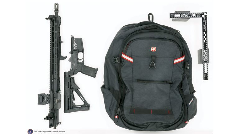 This image provided by the FBI shows Thomas Matthew Crooks' rifle broken down as was likely done for transport and the backpack recovered at the scene in Butler, Pa., July 13, 2024. Crooks searched online for events of both former President Donald Trump and President Joe Biden and saw the Pennsylvania campaign rally where he opened fire as a "target of opportunity," a senior FBI official said. (FBI via AP)