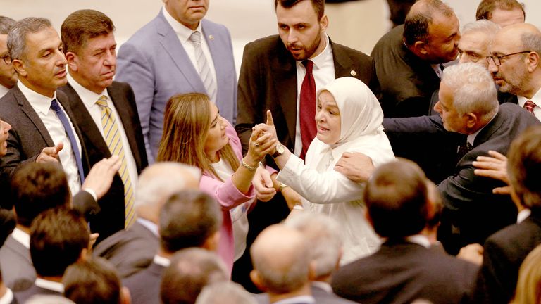 Turkey's ruling AK Party (AKP) and opposition lawmakers argue during an extraordinary meeting of the Turkish parliament to discuss jailed opposition lawmaker Can Atalay's return to the assembly, in Ankara, Turkey August 16, 2024. REUTERS/Cagla Gurdogan