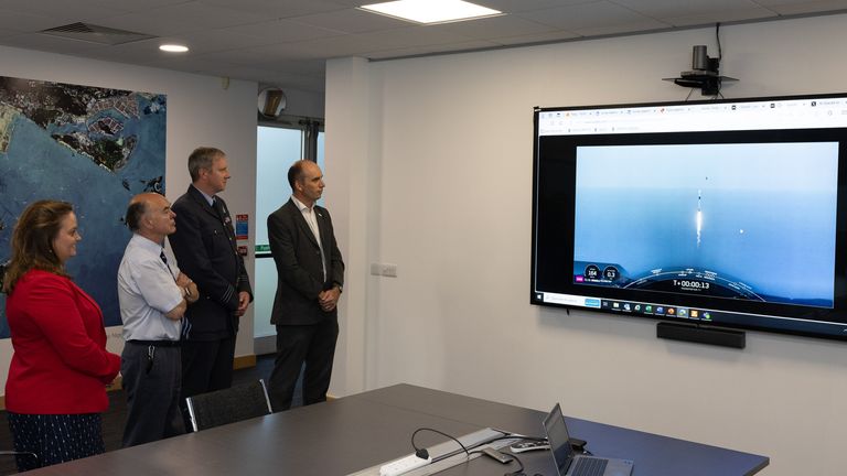 Personnel from UK Space Command, Defence Equipment and Support (DE&S) and Andrew Cawthorne (Managing Director of SSTL) watch live as the Falcon 9 Rocket is launched from  Vandenberg Space Force Base, California, by SpaceX with the UK Space Command Satellite inside on the 16/08/24...A UK satellite to support military operations was successfully launched into space last night. .Tyche, is the first UK Space Command satellite which can capture daytime images and videos of the Earth...s surface.... .Tyche was launched from Vandenberg Space Force Base, California, by SpaceX, on their reusable Falcon 9 rocket, as part of the ...Transporter 11... mission........The satellite will strengthen the UK...s Intelligence, Surveillance, and Reconnaissance (ISR) capabilities....... .Tyche is the first satellite to be launched under the Ministry of Defence...s space-based ISR programme, which will deliver a constellation of satellites and supporting ground systems by 2031........These satellites will not only support military operations, but also contribute to other government tasks, including natural disaster monitoring, the development of mapping information, environmental monitoring and tracking the impact of climate change around the world....... .Designed and built in the UK through a ..22 million contract awarded by Defence Equipment & Support to Surrey Satellites Technology Limited (SSTL), Tyche is the first satellite to be fully owned by the Ministry of Defence.... The design and build of the 150-kilogramme satellite has supported around 100 high-skilled roles at SSTL since 2022........Operating in Low Earth Orbit over a five-year lifespan, Tyche will provide timely space-based imagery in support of the UK Armed Forces. .