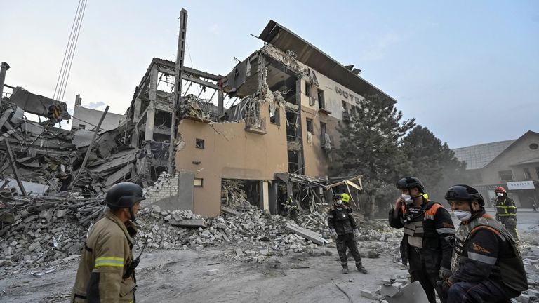 Rescuers stand at a site of a Russian missile strike, amid Russia's attack on Ukraine, in Kryvyi Rih, Ukraine August 27, 2024. REUTERS/Stringer