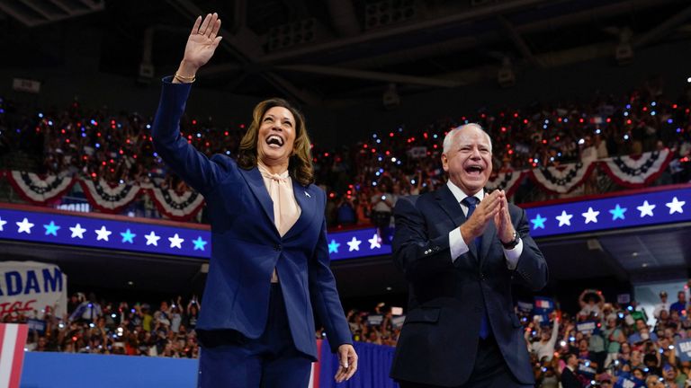 U.S. Vice President and Democratic presidential candidate Kamala Harris and her newly chosen vice presidential running mate Minnesota Governor Tim Walz react as they hold a campaign rally in Philadelphia, Pennsylvania, U.S., August 6, 2024. REUTERS/Elizabeth Frantz