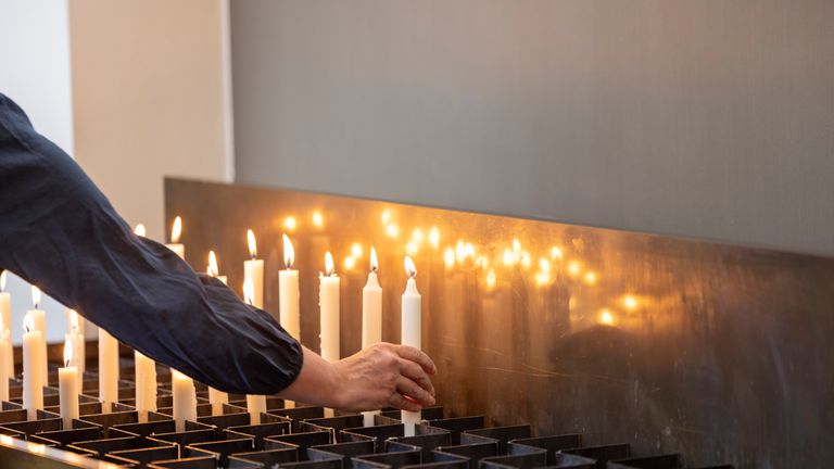 Candles placed at church near to where attack occurred. Pic: Thomas Banneyer/picture-alliance/dpa/AP