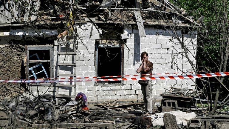 A resident reacts to damage in the Novohupalivka region. Pic: AP