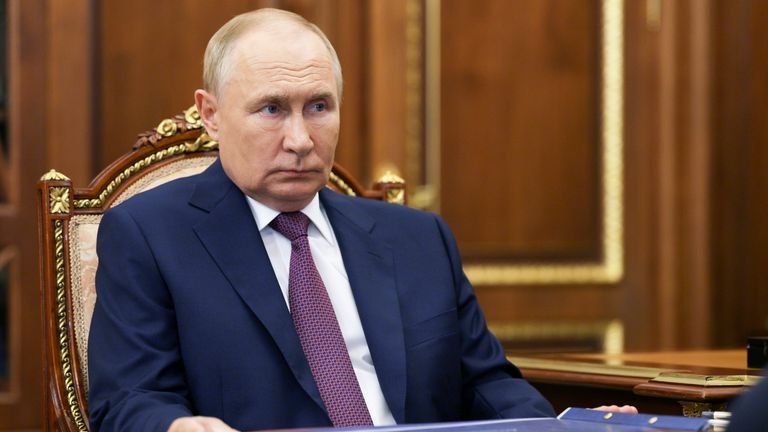 Vladimir Putin listens to Astrakhan region governor Igor Babushkin during their meeting at the Kremlin in Moscow.
Pic: AP