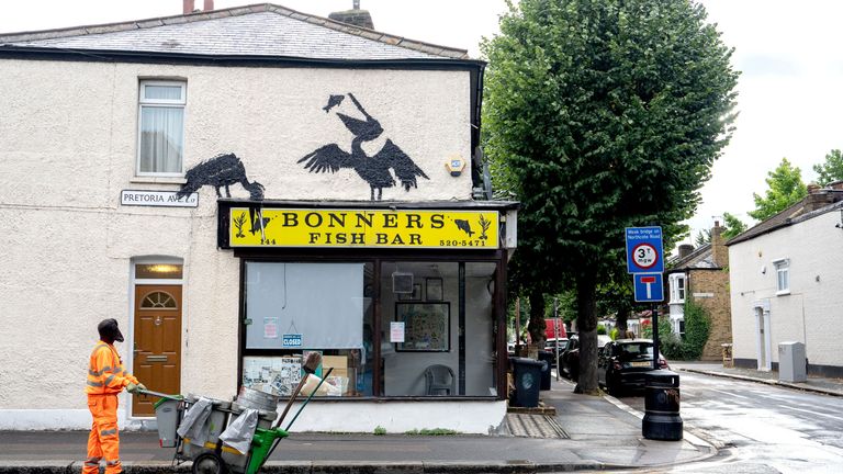 Banksy's new artwork depicting pelicans eating fish, painted on the side of Bonners Fish Bar in Walthamstow.
Pic: PA