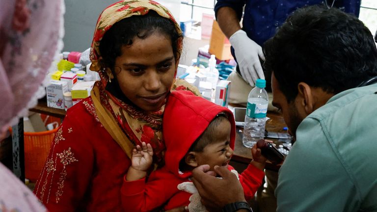 A doctor inspects a child inside a relief camp, after landslides hit several villages in Wayanad district, in Meppadi, in the southern state of Kerala, India, August 2, 2024. REUTERS/Francis Mascarenhas