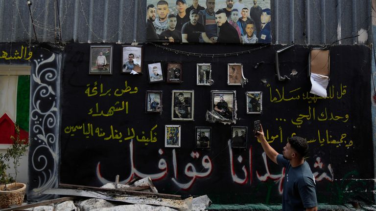 A memorial wall of Palestinians who have died in previous clashes. Pic: AP