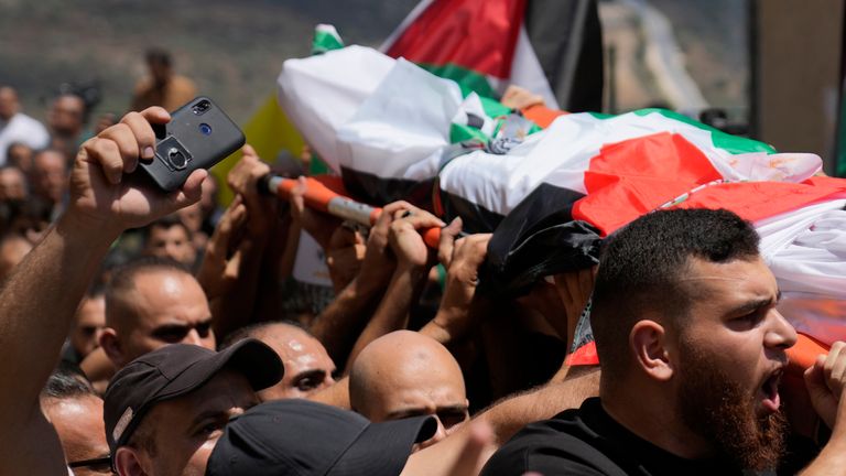 Mourners carry the body of Mahmoud Abdel Qader Sadda who was killed during the rampage of Israeli settlers. Pic: AP