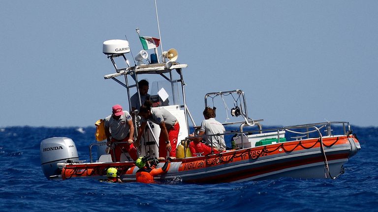 Rescue personnel and divers operate in search for the missing, including British entrepreneur Mike Lynch, in the area where a luxury yacht sank off the coast of Porticello, near the Sicilian city of Palermo, Italy, August 21, 2024. REUTERS/Guglielmo Mangiapane TPX IMAGES OF THE DAY