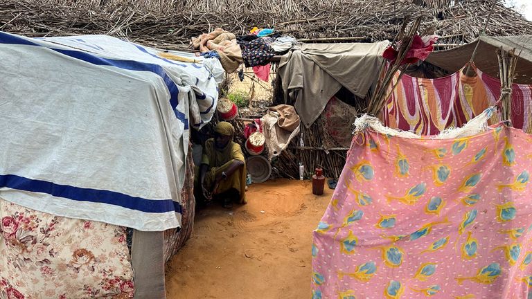 A displaced Sudanese woman rests inside a shelter at Zamzam camp, in North Darfur, Sudan, August 1, 2024. REUTERS/Mohamed Jamal Jebrel