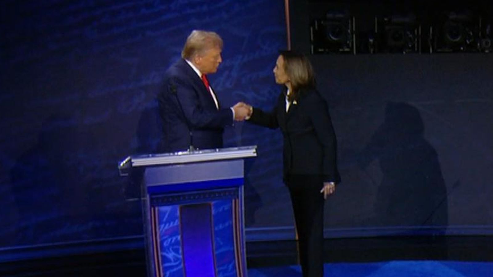 Kamala Harris walks to Donald Trump for handshake at start of ...