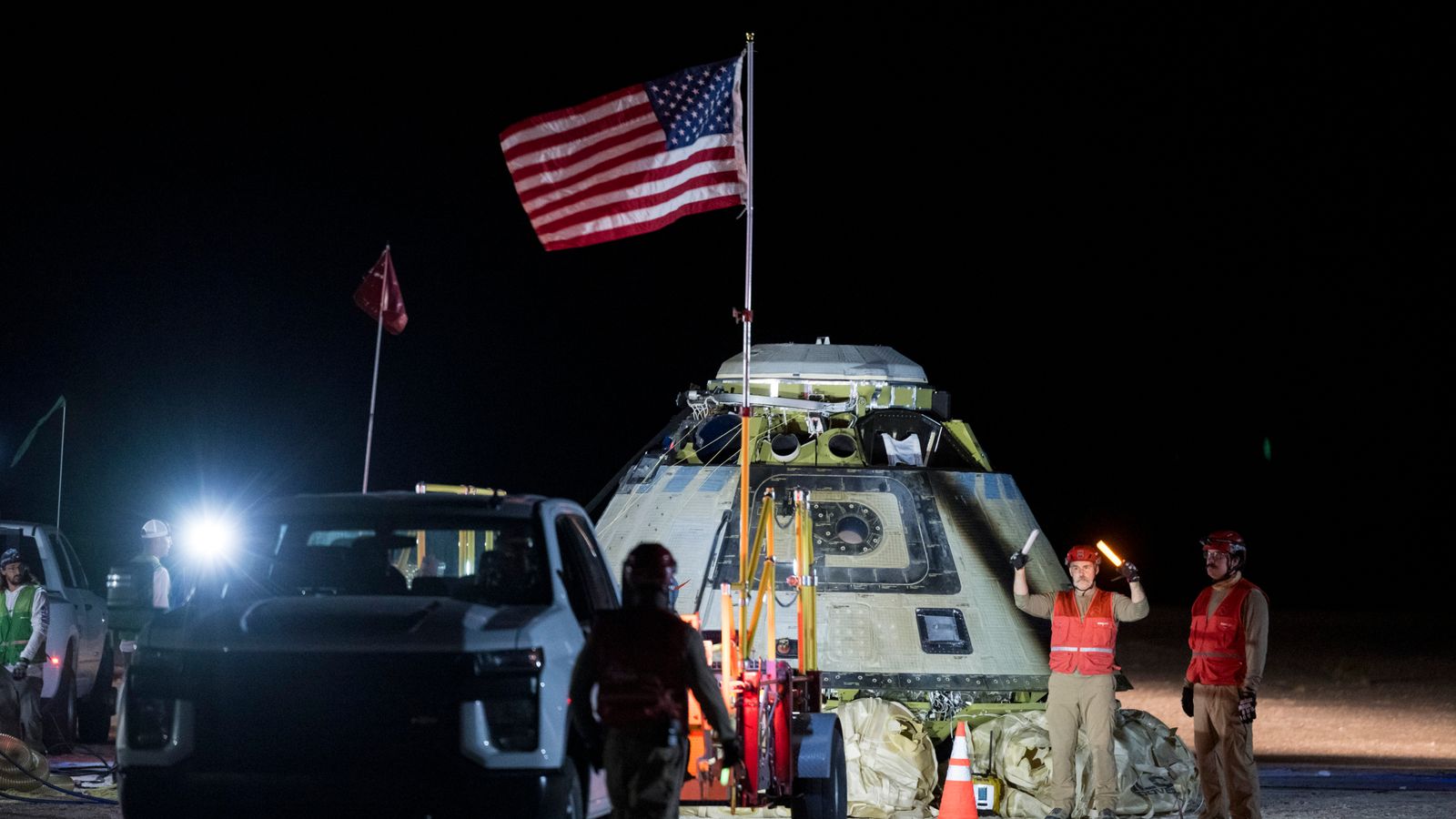 Troubled spacecraft lands back on Earth - but leaves astronauts behind