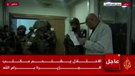 Al Jazeera's bureau chief in Israel and the Palestinian Territories, Walid al-Omari, reads from military order papers that were handed to him by Israeli soldiers at the Al Jazeera office in Ramallah, in the Israeli-occupied West Bank, September 22, 2024 in this screen grab from video. REUTERS TV/Al Jazeera via Reuters THIS IMAGE HAS BEEN SUPPLIED BY A THIRD PARTY. MANDATORY CREDIT. OVERLAYS FROM SOURCE.