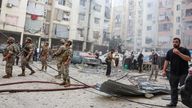 People and members of the military inspect the site of an Israeli strike in the southern suburbs of Beirut, Lebanon, September 20, 2024. REUTERS/Mohamed Azakir