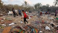 People inspect the site following Israeli strikes on a tent camp sheltering displaced people, amid the Israel-Hamas conflict, at the Al-Mawasi area in Khan Younis, in the southern Gaza Strip, September 10, 2024. REUTERS/Mohammed Salem