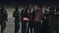 Phillip Mark Mehrtens, center, is greeted by New Zealand Ambassador to Indonesia Kevin Burnett and Indonesian officials . Pic: AP