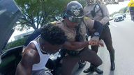 Miami Dolphins receiver Tyreek Hill is forced from his vehicle by Miami-Dade Police Department officers in Miami, Florida, September 8, 2024 in a still image from police body camera video. Miami-Dade Police Department/Handout via REUTERS. THIS IMAGE HAS BEEN SUPPLIED BY A THIRD PARTY
