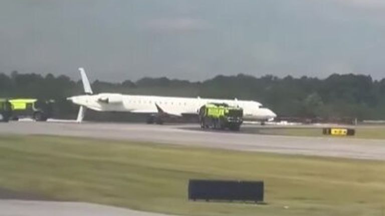 A passenger plane was hit by the wing of a larger plane on a taxiway and had its tail cut.
