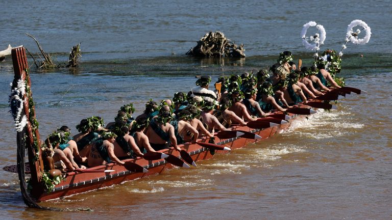 A waka, a traditional canoe, is paddled by warriors on the Waikato River as part of the funeral of New Zealand's Maori King, Kiingi Tuheitia Pootatau Te Wherowhero VII, in Ngaruawahia, New Zealand, Thursday, Sept. 5, 2024. (AP Photo/Alan Gibson)