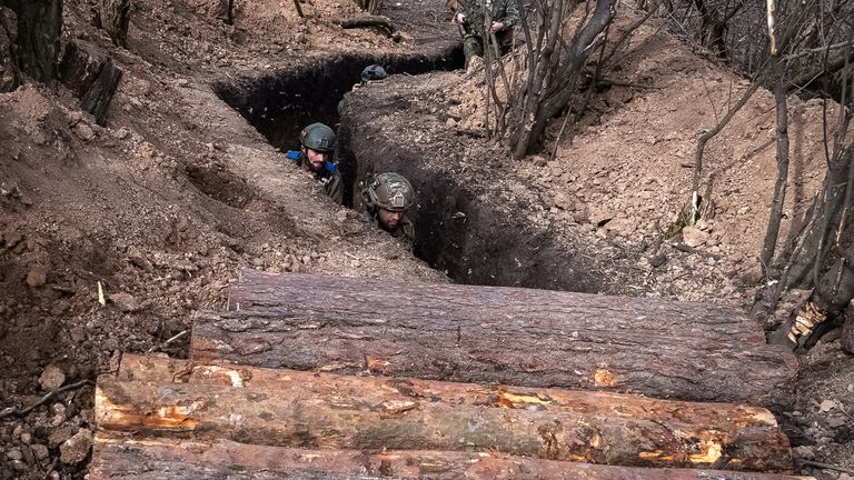 Ukrainian servicemen inside a trench near the town of Bakhmut in March. Pic: Reuters