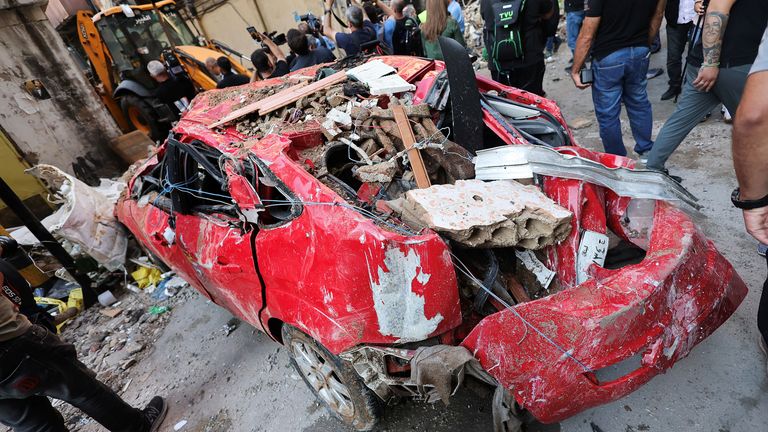 Debris lies on top of a destroyed car, at the site of an Israeli strike in Beirut's southern suburbs, Lebanon September 24, 2024. REUTERS/Amr Abdallah Dalsh
