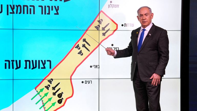 Israeli Prime Minister Benjamin Netanyahu stands before a map of the Gaza Strip, telling viewers how Hamas has imported arms into the territory since Israel's withdrawal in 2005, during a news conference in Jerusalem, September 2, 2024. Hebrew onscreen reads, "Gaza after the disengagement, oxygen pipe of Hamas". Ohad Zwigenberg/Pool via REUTERS