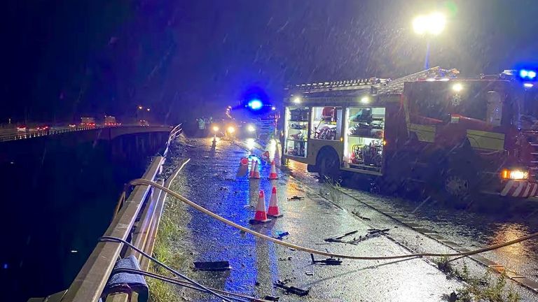 Cheshire Fire and Rescue Service handout photo of emergency services on the scene under a bridge on the M6 in Cheshire where a lorry fell 60 metres from the Thelwall Viaduct between junctions 20 and 21, landing on the embankment below. Issue date: Monday September 30, 2024. Cheshire Fire and Rescue Service/PA Wire