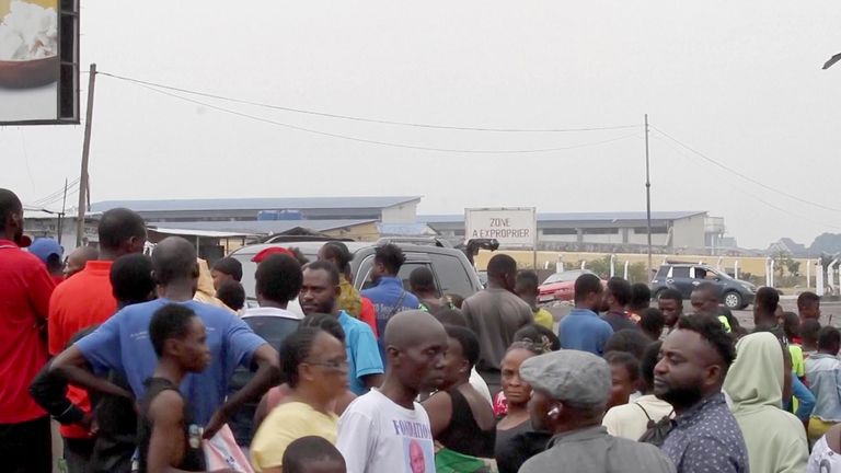 Local residents looking on as security forces guard the prison.
Pic: AP