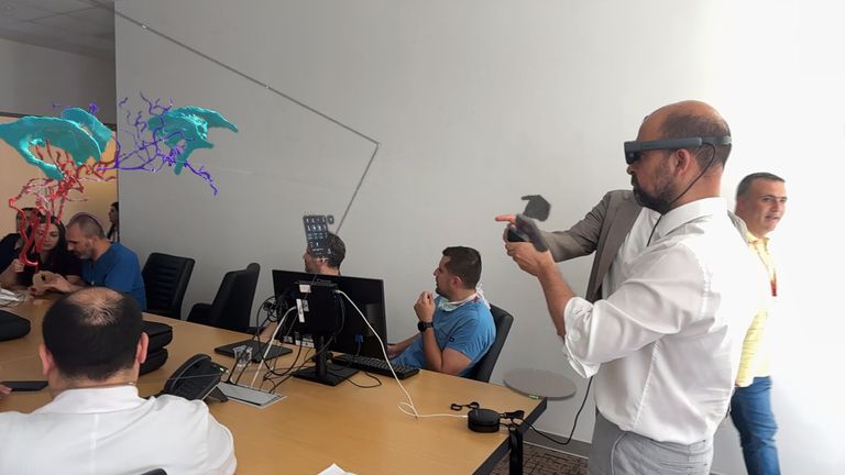 Medics demonstrating mixed reality to plan surgery for conjoined one-year-old twin girls Minal and Mirha who were separated during an operation at Ankara Bilkent City Hospital in Turkey on 19 July 2024. Work was supported by Gemini Untwined, a charity founded by Professor Noor ul Owase Jeelani from Great Ormond Street Hospital. handout from charity